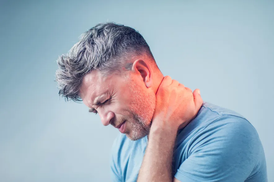 Man holding neck for headache tumor pain