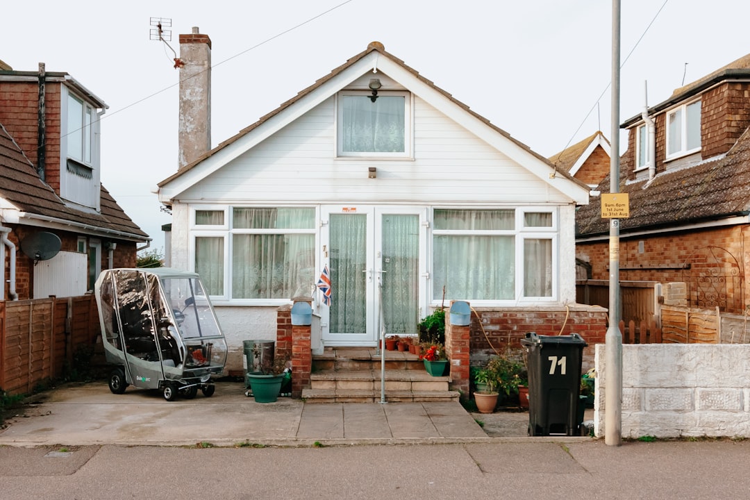 A house with a car parked in front of it