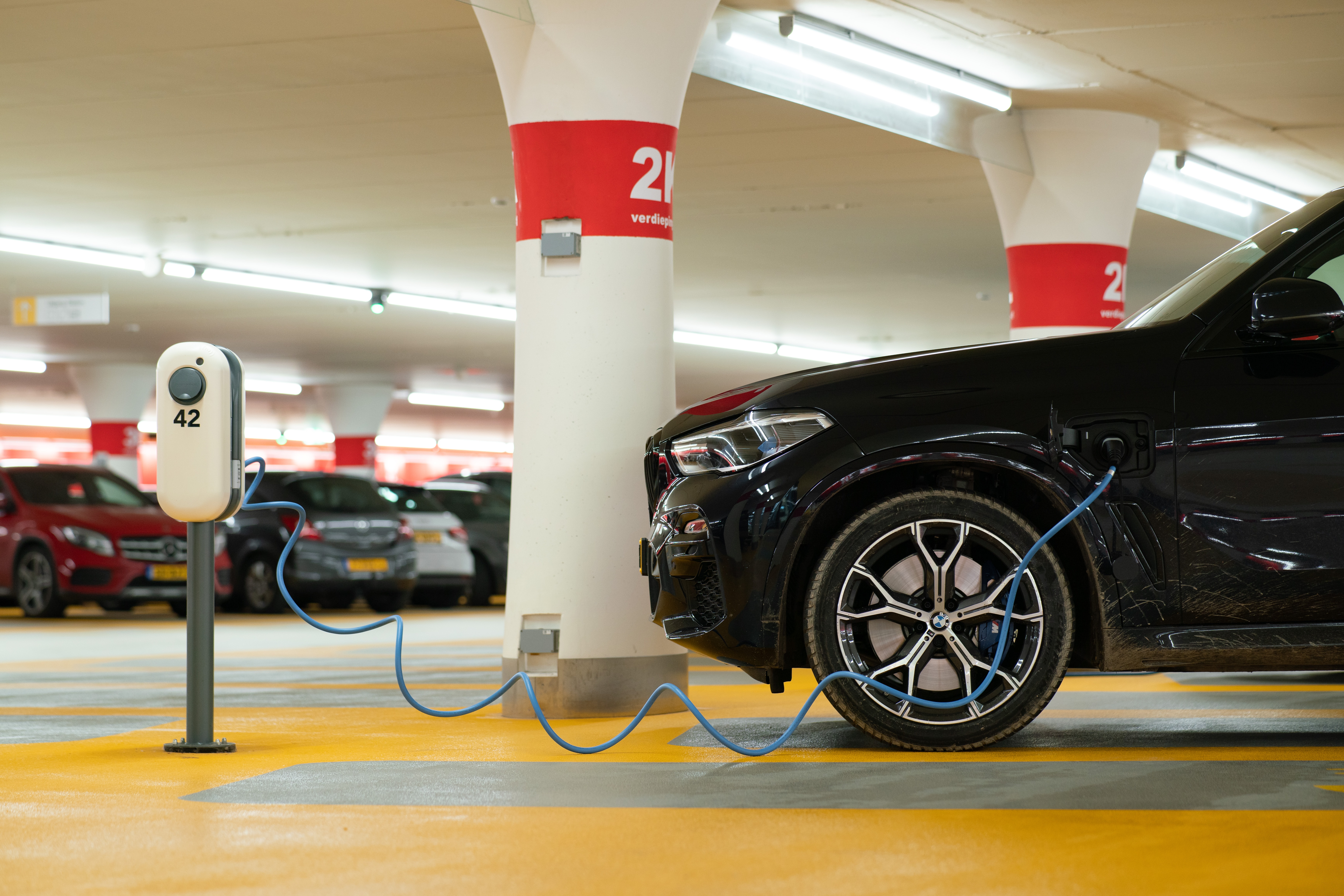 Charging electric car in parking